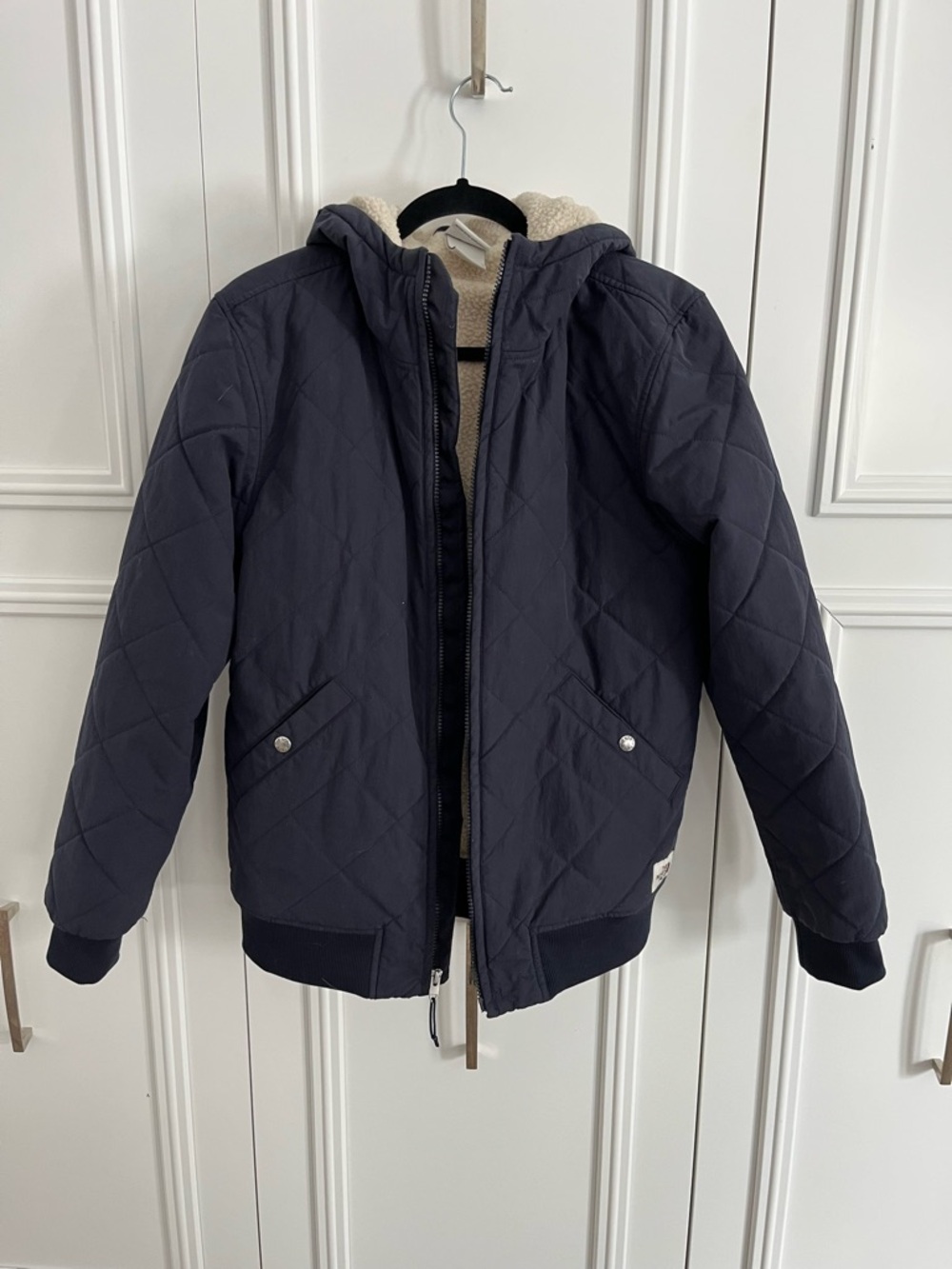 The North Face Men's Quilted Bomber Jacket in Navy with Sherpa Lining